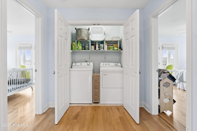 9089 W 9th St, Surf City, NC 28445 - laundry room featuring washing machine and clothes dryer, light wood-type flooring, and baseboards