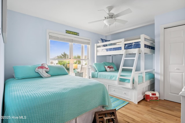 9089 W 9th St, Surf City, NC 28445 - bedroom with light wood-style floors and ceiling fan
