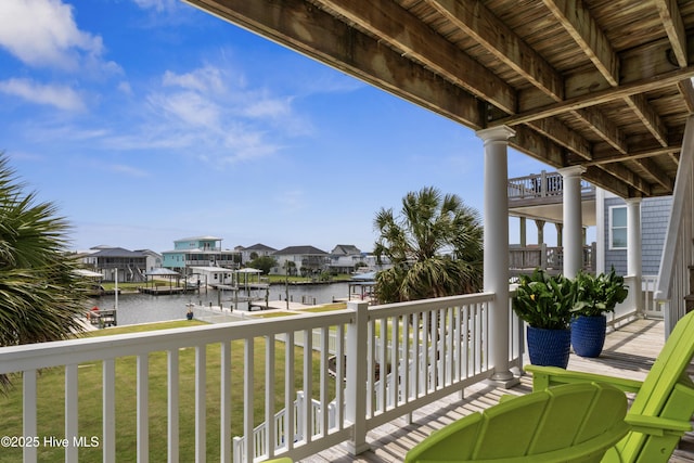 9089 W 9th St, Surf City, NC 28445 - balcony featuring a water view, a dock, boat lift, and a residential view