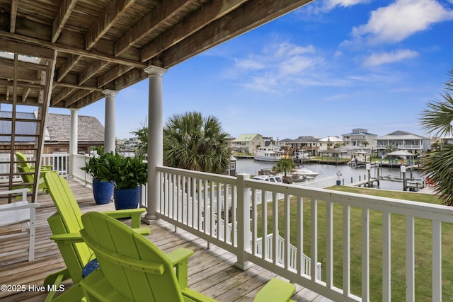 9089 W 9th St, Surf City, NC 28445 - wooden terrace featuring a water view, a lawn, a dock, a residential view, and boat lift