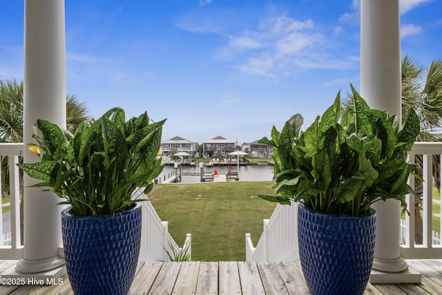 9089 W 9th St, Surf City, NC 28445 - wooden terrace with a water view, a yard, a dock, and boat lift