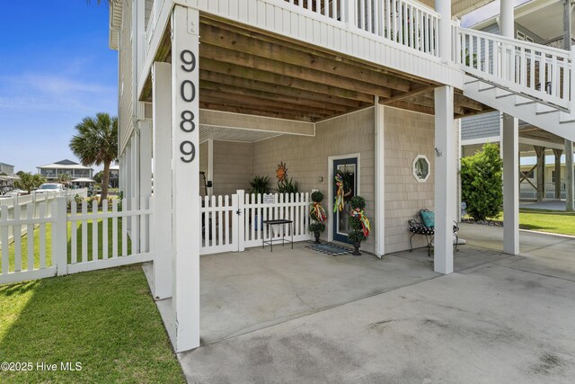 9089 W 9th St, Surf City, NC 28445 - view of patio featuring a carport