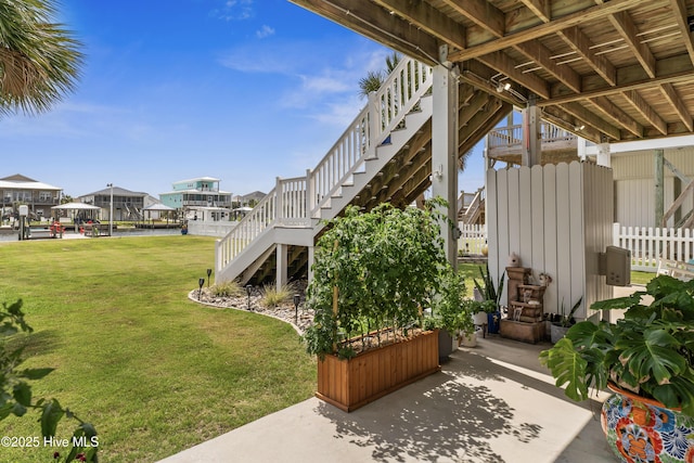9089 W 9th St, Surf City, NC 28445 - view of yard featuring stairs and a residential view