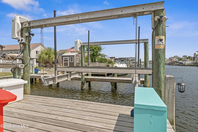9089 W 9th St, Surf City, NC 28445 - dock area featuring boat lift and a water view