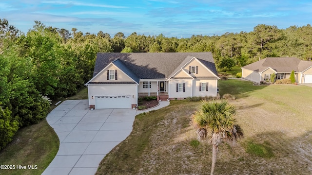 358 Folkstone Rd, Holly Ridge, NC 28445 - traditional-style house with concrete driveway, a front lawn, a garage, and covered porch