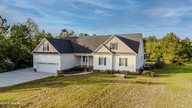 358 Folkstone Rd, Holly Ridge, NC 28445 - traditional home with a front lawn, concrete driveway, central AC unit, and a garage