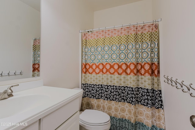 358 Folkstone Rd, Holly Ridge, NC 28445 - bathroom with vanity, toilet, and a shower with curtain