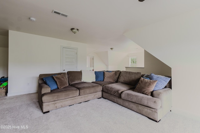 358 Folkstone Rd, Holly Ridge, NC 28445 - carpeted living area featuring baseboards and vaulted ceiling