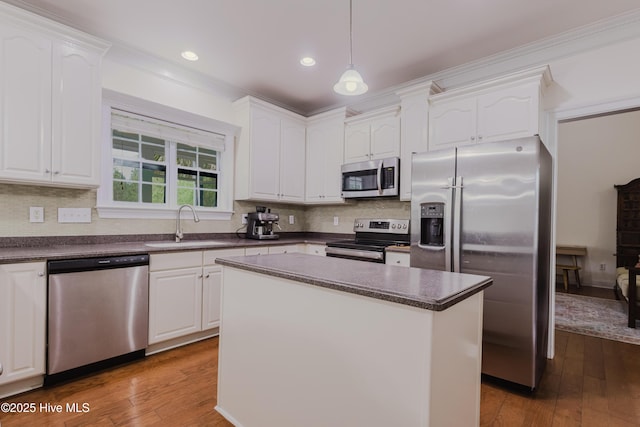 358 Folkstone Rd, Holly Ridge, NC 28445 - kitchen with appliances with stainless steel finishes, a sink, dark countertops, white cabinetry, and recessed lighting