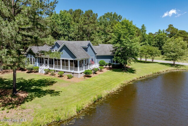 244 Red Fox Run Dr, Wallace, NC 28466 - rear view of property with roof with shingles, a yard, a water view, and a sunroom