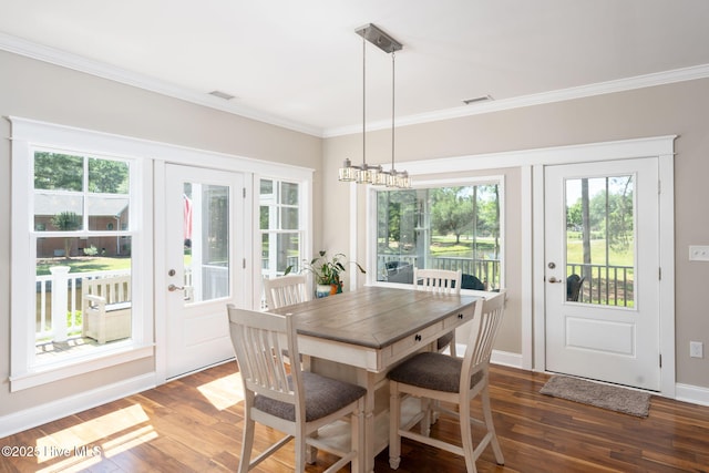 244 Red Fox Run Dr, Wallace, NC 28466 - dining room with wood finished floors, a chandelier, and crown molding