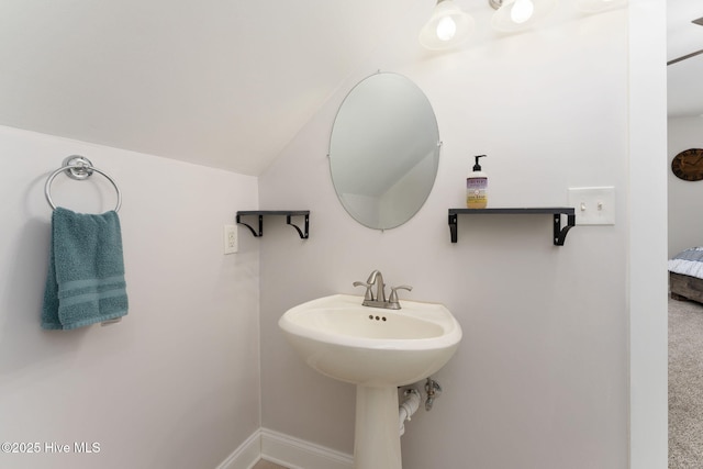 244 Red Fox Run Dr, Wallace, NC 28466 - bathroom with lofted ceiling and baseboards