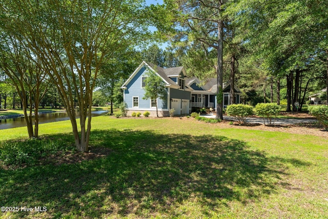 244 Red Fox Run Dr, Wallace, NC 28466 - view of front of house with a front lawn and a water view