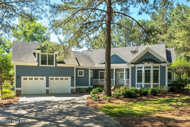 244 Red Fox Run Dr, Wallace, NC 28466 - view of front facade with covered porch, concrete driveway, and roof with shingles