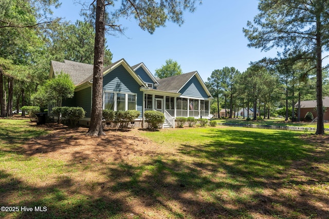 244 Red Fox Run Dr, Wallace, NC 28466 - rear view of property featuring a sunroom, crawl space, a lawn, and roof with shingles