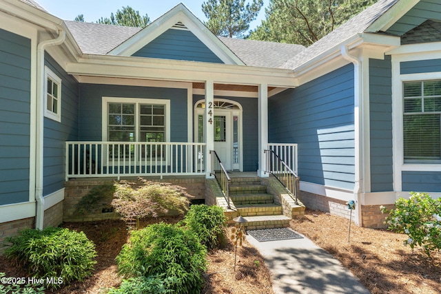 244 Red Fox Run Dr, Wallace, NC 28466 - entrance to property featuring a shingled roof, crawl space, and covered porch