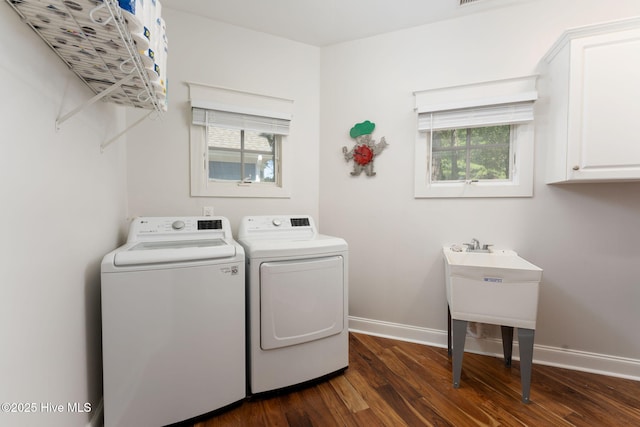 244 Red Fox Run Dr, Wallace, NC 28466 - laundry area featuring cabinet space, washer and clothes dryer, dark wood-style floors, and healthy amount of natural light