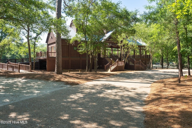 244 Red Fox Run Dr, Wallace, NC 28466 - view of play area featuring stairs, a porch, and a deck