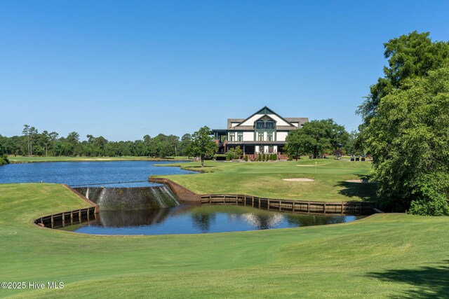 244 Red Fox Run Dr, Wallace, NC 28466 - view of property's community with a water view, view of golf course, and a yard