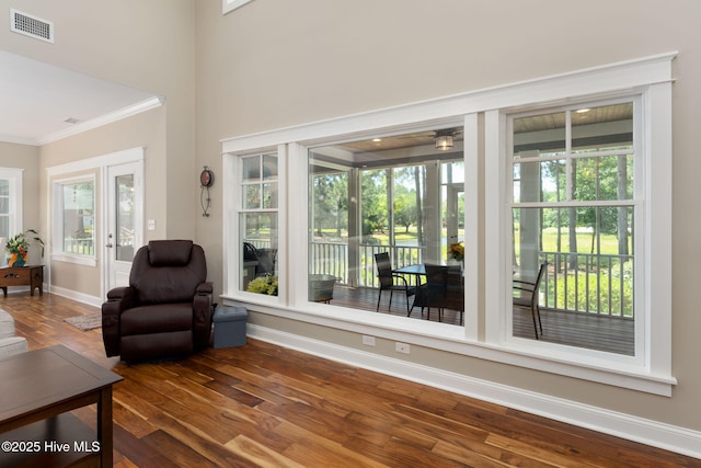 244 Red Fox Run Dr, Wallace, NC 28466 - living area featuring crown molding, wood finished floors, and healthy amount of natural light