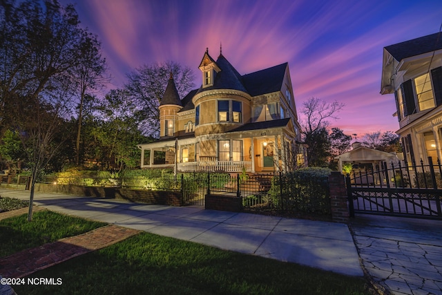 412 S 3rd St, Wilmington, NC 28401 - victorian house with a gate, a fenced front yard, and a porch