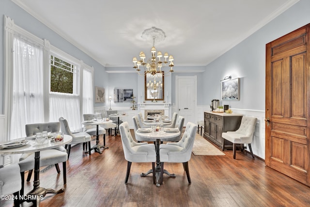 412 S 3rd St, Wilmington, NC 28401 - dining space with a chandelier, ornamental molding, wainscoting, and dark wood finished floors