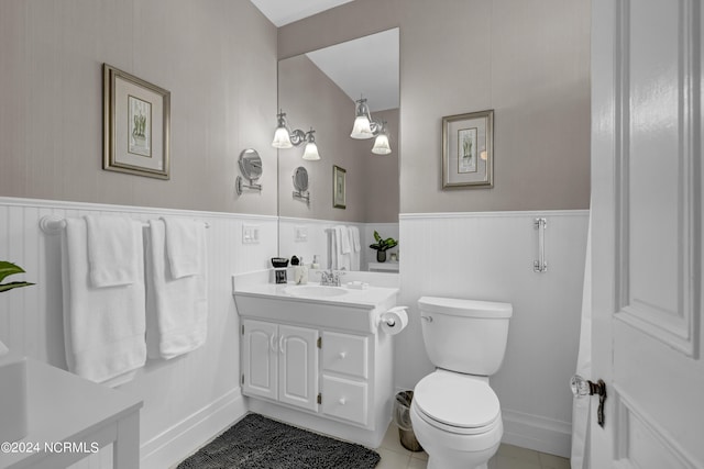 412 S 3rd St, Wilmington, NC 28401 - bathroom featuring vanity, wainscoting, toilet, and tile patterned floors