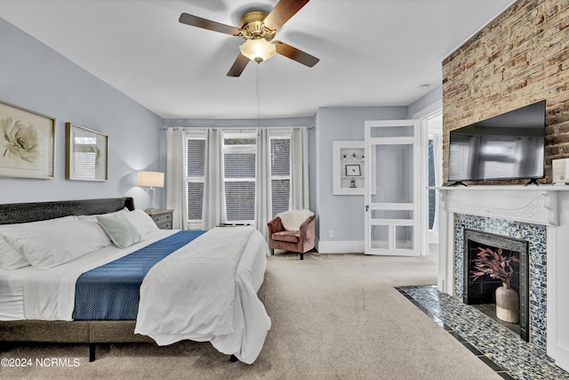 412 S 3rd St, Wilmington, NC 28401 - bedroom with carpet flooring, a fireplace, and a ceiling fan