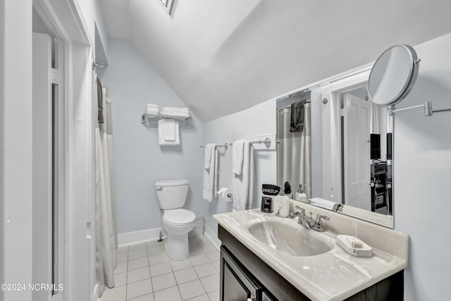 412 S 3rd St, Wilmington, NC 28401 - bathroom with vanity, tile patterned flooring, vaulted ceiling, toilet, and baseboards