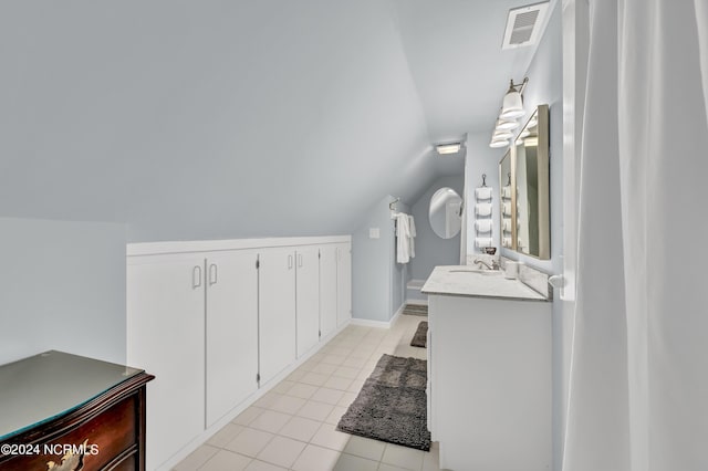412 S 3rd St, Wilmington, NC 28401 - bathroom with lofted ceiling, vanity, and tile patterned floors