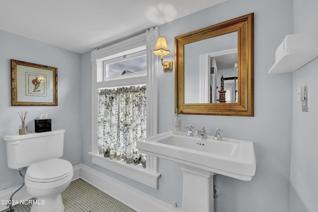 412 S 3rd St, Wilmington, NC 28401 - bathroom with toilet, a sink, tile patterned floors, and baseboards