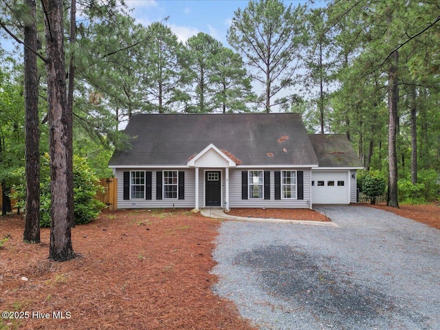 8 Saunders Ln, Pinehurst, NC 28374 - cape cod house featuring driveway and a garage