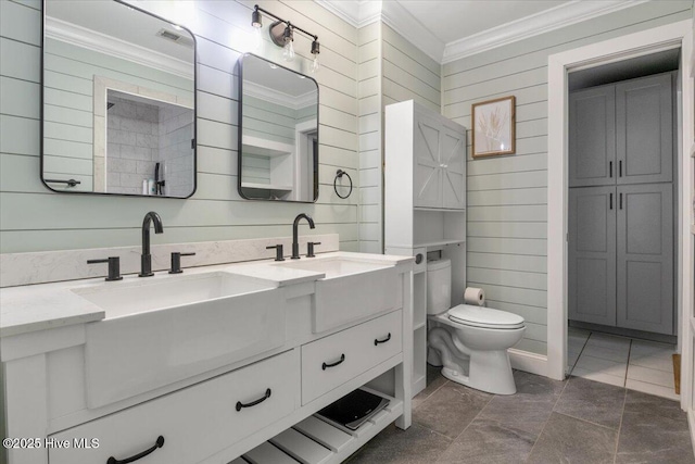 8 Saunders Ln, Pinehurst, NC 28374 - full bathroom featuring ornamental molding, double vanity, toilet, and wooden walls