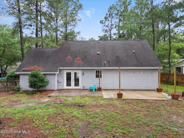 8 Saunders Ln, Pinehurst, NC 28374 - back of property featuring french doors, a patio, and a shingled roof