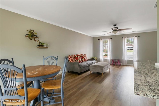 8 Saunders Ln, Pinehurst, NC 28374 - living room featuring wood finished floors, ceiling fan, crown molding, and baseboards