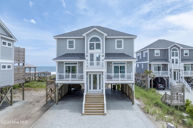 1012 New River Inlet Rd, North Topsail Beach, NC 28460 - coastal home with a carport, driveway, and stairway