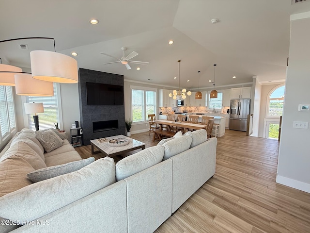 1012 New River Inlet Rd, North Topsail Beach, NC 28460 - living room with plenty of natural light, ceiling fan, baseboards, recessed lighting, and a tiled fireplace