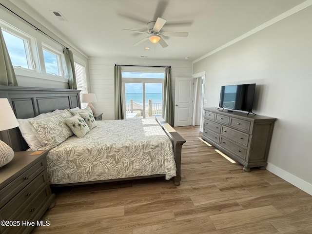 1012 New River Inlet Rd, North Topsail Beach, NC 28460 - bedroom featuring access to outside, wood finished floors, baseboards, ceiling fan, and crown molding