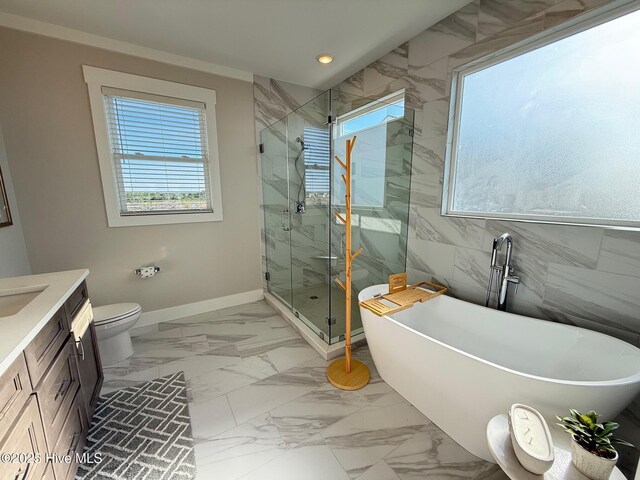 1012 New River Inlet Rd, North Topsail Beach, NC 28460 - full bath with healthy amount of natural light, marble look tiles, a freestanding bath, a marble finish shower, and tile walls