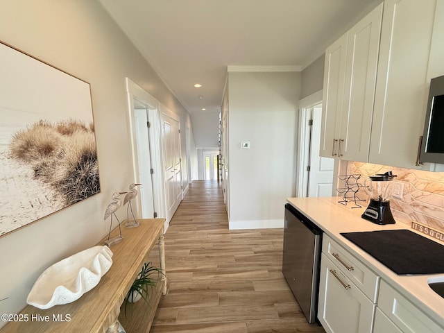 1012 New River Inlet Rd, North Topsail Beach, NC 28460 - hall with light wood finished floors, recessed lighting, and baseboards