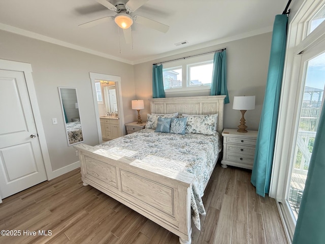 1012 New River Inlet Rd, North Topsail Beach, NC 28460 - bedroom featuring wood finished floors, ornamental molding, a ceiling fan, and baseboards