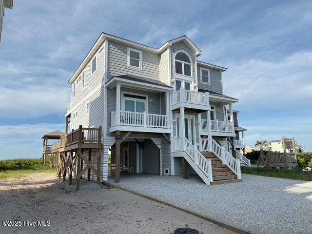 1012 New River Inlet Rd, North Topsail Beach, NC 28460 - coastal home featuring a carport and dirt driveway