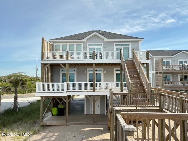 1012 New River Inlet Rd, North Topsail Beach, NC 28460 - rear view of house with a deck, stairs, a carport, and driveway