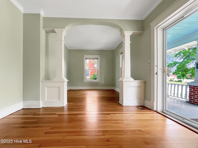 110 Virginia Rd, Edenton, NC 27932 - empty room with ornate columns, light wood-style flooring, crown molding, and baseboards