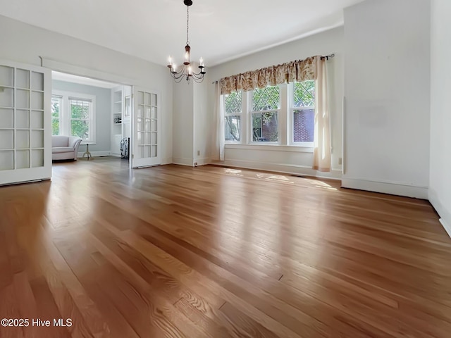 110 Virginia Rd, Edenton, NC 27932 - empty room featuring a chandelier, wood finished floors, and baseboards