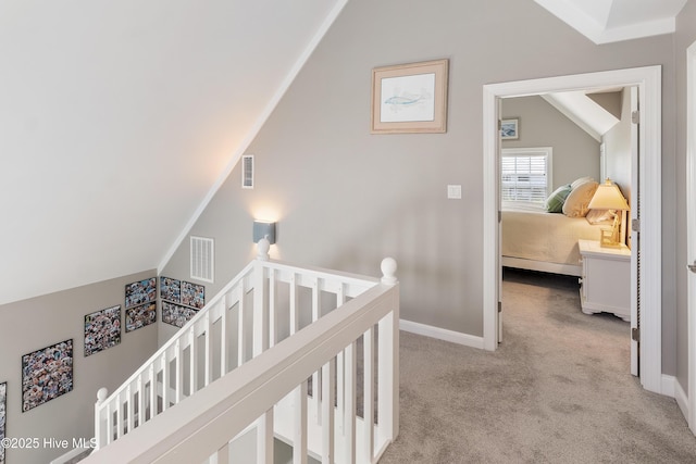 299 Waterway Dr, Sneads Ferry, NC 28460 - hall with an upstairs landing, carpet flooring, baseboards, and lofted ceiling