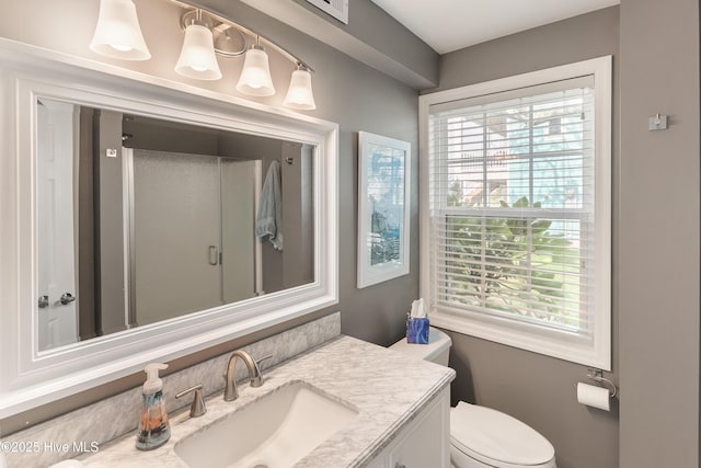 299 Waterway Dr, Sneads Ferry, NC 28460 - bathroom with vanity, healthy amount of natural light, toilet, and a shower with shower door