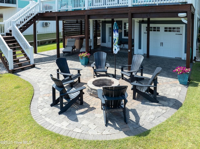299 Waterway Dr, Sneads Ferry, NC 28460 - view of patio featuring an outdoor fire pit, stairs, a deck, and a garage