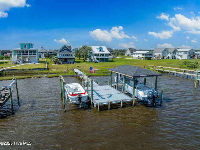 299 Waterway Dr, Sneads Ferry, NC 28460 - dock area with boat lift, a water view, a yard, and a residential view