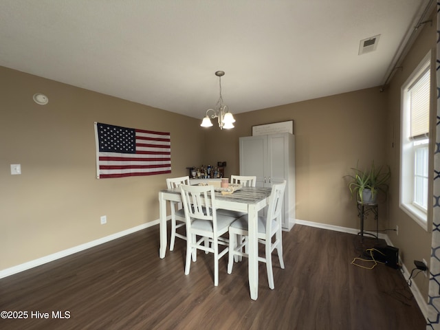 141 Jessie Cir, Hubert, NC 28539 - dining room featuring dark wood-type flooring, a chandelier, and plenty of natural light